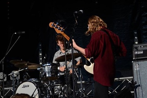 two guys playing in a band